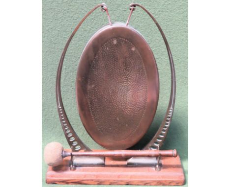 Vintage brass gong with striker, mounted on oak stand. Approx. 37cm H

Reasonable used condition 