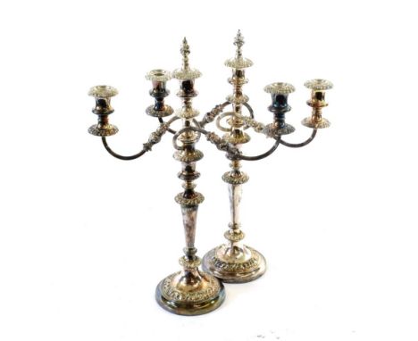 A Pair of Silver-Plated Three-Light Candelabra, 19th Century, on circular base with fruiting grapevine heightened gadrooned b