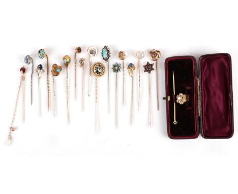 Eighteen Stick Pins; including a garnet and houndstooth pearl example, a carved and turquoise inset ovoid example, a garnet s