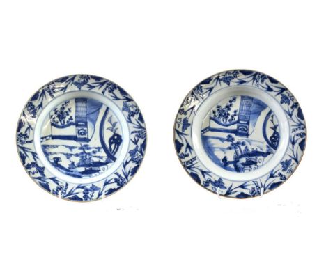 A Pair of Chinese Porcelain Plates, Qianlong, painted in underglaze blue with a figure and buildings, architectural details b