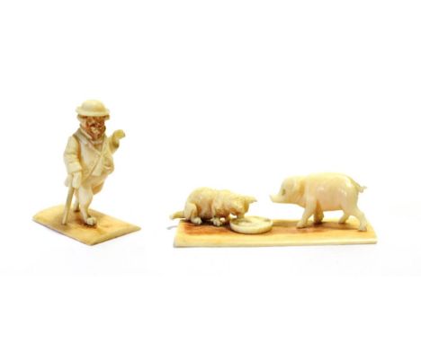 An Austrian Ivory Anthropomorphic Figure of a Pup, circa 1900, walking on its hind legs wearing a bowler hat and jacket, hold