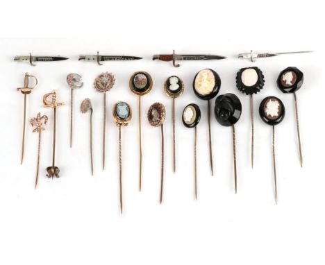 Twenty Stick Pins; including a portrait and garnet example in a shaped case, a micro-mosaic example, six sword/dagger example