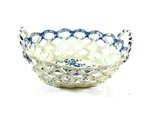 A Worcester Porcelain Oval Basket, circa 1775, with crabstock handles, printed in underglaze blue with The Pine Cone pattern,