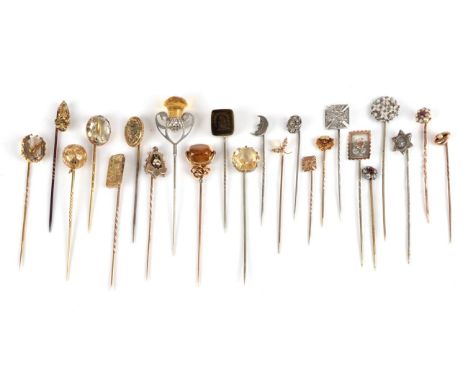 Twenty-Three Stick Pins; including a hexagonal citrine set pin, cased, a thistle motif, a seal set pin, a pearl and shell exa