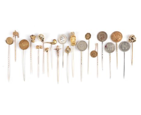 Twenty Stick Pins; including a knot, cased; coin examples; an owl example; a pipe example etc   Provenance: Private North Eas