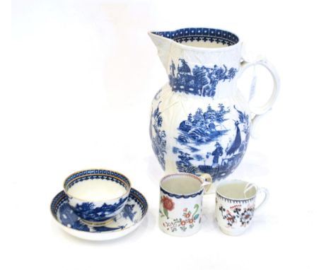 A Caughley Porcelain Mask Jug, circa 1780, printed in underglaze blue The Fisherman pattern, 23cm high; A Similar Tea Bowl an
