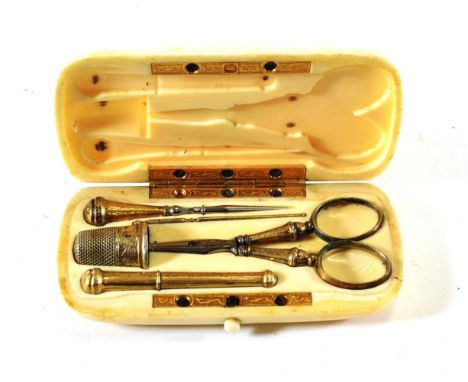 A French Ivory Cased Manicure Set, late 19th century, the cover with a monogram, containing silver gilt and gilt metal mounte