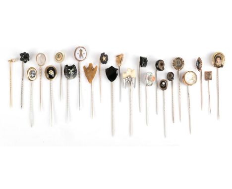 Twenty-Three Stick Pins; including a harpsichord example; two ammonite examples, several jet examples, a pearl example with a