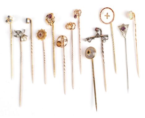 Thirteen Stick Pins; including a sapphire and seed pearl example in a case; an opal example also cased, a mother-of-pearl and