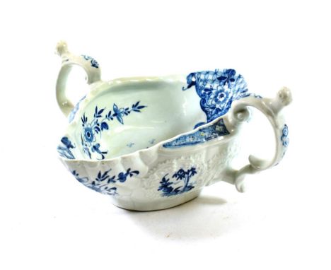 A Worcester Porcelain Two-Handled Sauce Boat, circa 1755, painted in underglaze blue with The Two-Handled Sauce Boat Landscap
