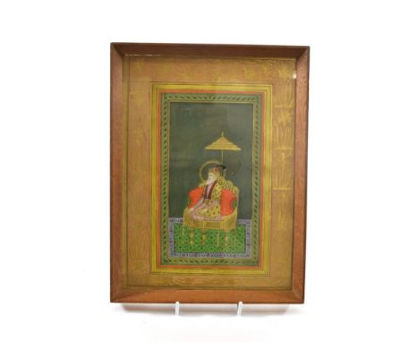 Indian School (18th/19th century) Portrait of a Dignitary seated on a sofa  Watercolour and gilding, 19cm by 10cm, within a p