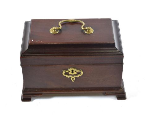 A George III Mahogany Tea Caddy, the domed hinged top with brass handle, on a rectangular base and ogee bracket feet, 25cm wi