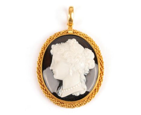 A Victorian Agate Cameo Pendant, depicting a portrait of a lady, in a rope effect frame, measures 4.2cm by 6.2cm, in a fitted