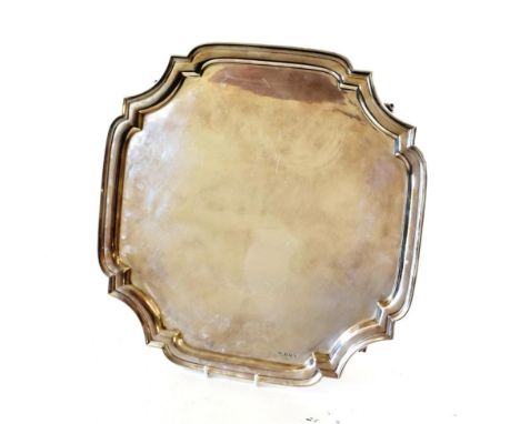 A George VI Silver Salver, by Viners, Sheffield, 1937, shaped square and on four foliate scroll feet, 42cm square, 58oz 1dwt.