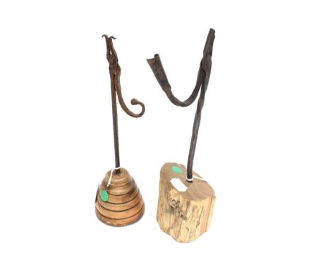A Wrought Iron Rush Light Holder, 18th/early 19th century, of scissor form with socket, on a log base, 36cm high; and A Simil