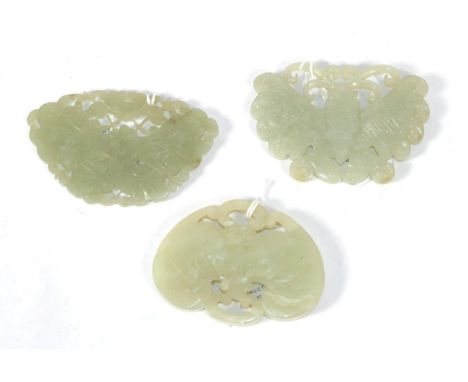 A Chinese Jade Plaque, carved and pierced as a moth, 9cm wide; A Similar Plaque, 9cm wide; and A Plaque, carved as a bat, 8cm