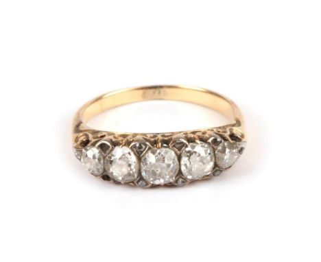 A Late 19th Century Diamond Five Stone Ring, the graduated old cut diamonds with pairs of tiny rose cut diamond accents betwe