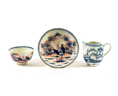 A Worcester Porcelain Barrel Shaped Cream Jug, circa 1770, painted in underglaze blue with The Cannon Ball pattern, crescent 