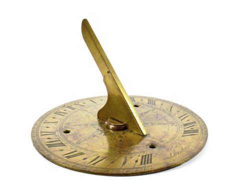 A Brass Horizontal Garden Sun Dial, signed Messer London, with engraved hours and minutes scale and with compass star and pla