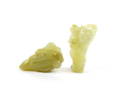 A Chinese Jade Carving of a Fruit, 5.5cm long; and A Similar Carving of a Boy, carrying flowers, 5.5cm long (2)