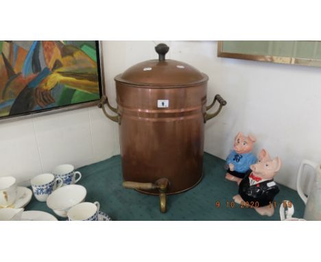 A vintage copper water storage drum