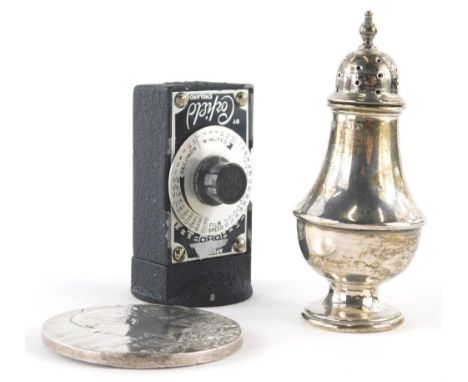 A Victorian two sided medallion, 6cm diameter, silver pepper pot, 1½oz, and a Corfield light meter. (3)