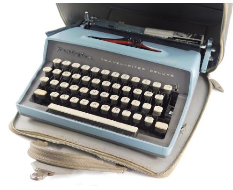 A vintage Remington Travel-riter Deluxe typewriter, in blue colourway, in fitted case, 32cm wide.