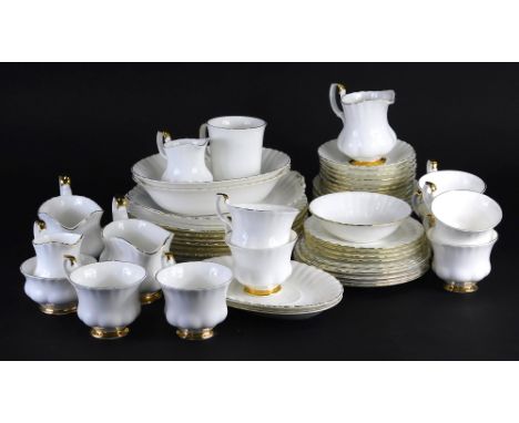 A Royal Albert Val D'or pattern part service, to include oval vegetable dishes, 23cm wide, gravy boats on stands, cups, sauce
