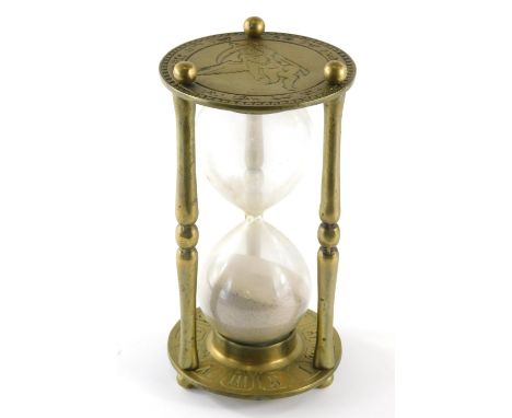 A 20thC brass and glass egg timer, of large proportion with figure of eight centre, 26cm high.