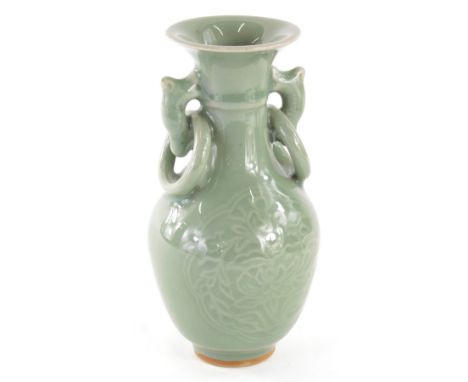 A Chinese celadon vase, of small proportions, with fixed ring handles and shouldered body, decorated with flowers, unmarked, 