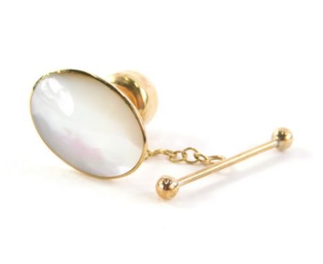 A mother of pearl collar stud, oval on a yellow metal back stamped 9ct, 1.3cm high, with additional safety clip bar, 2g all i