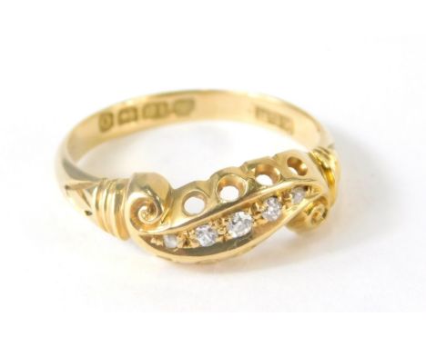 An 18ct gold dress ring, inset with tiny diamonds, 2.4g all in, size M.