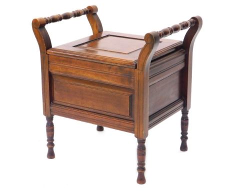 A late 19th/early 20thC walnut commode, the hinged panelled lid enclosing a ceramic pot with lid, on turned legs, 53cm wide.