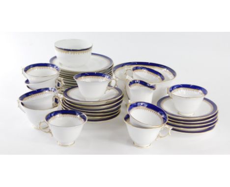 A late 19thC Royal Worcester tea service, in blue and white with gilt highlights, comprising slop bowl, 18cm diameter, milk j