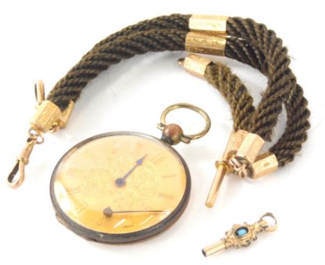 A twist watch chain, set with 9ct gold and other charms, 34cm long, a fancy watch key and early 20thC open faced pocket watch