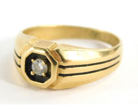 A dress ring with textured shank, claw set with central white stone, marks rubbed, size T.