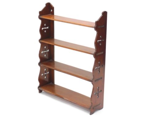 A Victorian mahogany three tier wall shelf, with shaped and Gothic pierced sides, 56cm wide, 74cm high.