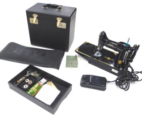 A Singer vintage metal cased sewing machine, of small proportion, in fitted case, 33cm wide, with a lift out tray and other a