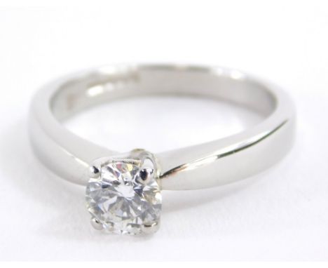 A platinum single stone diamond ring, with a round brilliant cut diamond, approx 0.5cts, in a four claw setting, size K.