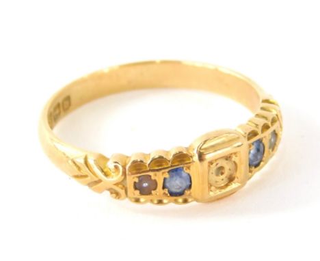 An 18ct gold dress ring, set with blue stones, size O-P. (AF)