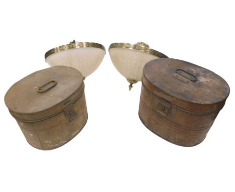 A pair of frosted glass light shades, with brass fittings and mounts, 42cm diameter, and two tin hat boxes. 