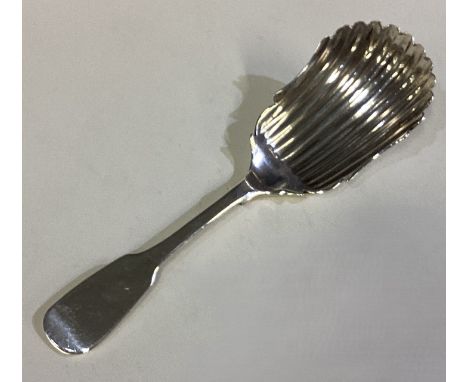 DUBLIN: An Irish silver caddy spoon of fluted design. 1824. By Matthew West. Approx. 14 grams. Est. £50 - £80.