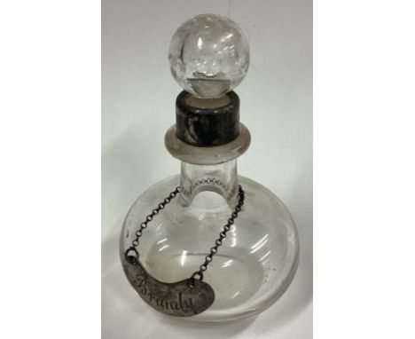 A silver mounted glass brandy noggin. Birmingham 1906. Est. £50 - £80.