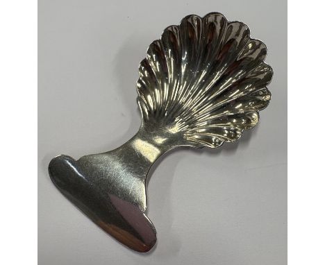 A good fluted silver caddy spoon in the Georgian style. Birmingham. Approx. 11 grams. Est. £20 - £30.