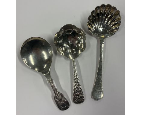 A group of three heavy silver caddy spoons. Various dates and makers. Approx. 53 grams. Est. £30 - £50.