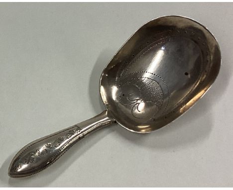 A George III silver caddy spoon with bright-cut decoration. Circa 1790. By John Taylor. Approx. 5 grams. Est. £40 - £60.