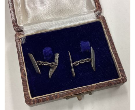 A cased pair of silver cufflinks. Approx. 4 grams. Est. £10 - £20.
