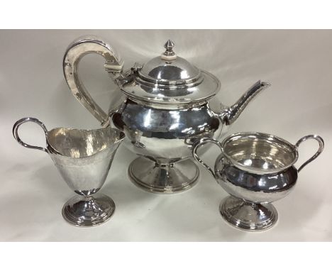 OMAR RAMSDEN: A fine and unusual silver three-piece tea service. Signed to base. London 1926. Approx. 828 grams. Est. £1500 -