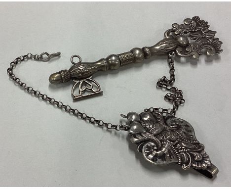 A rare Antique silver needle case on chatelaine. Approx. 28 grams. Est. £50 - £80.