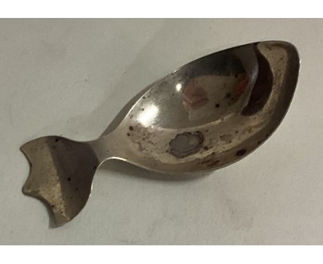A 19th Century Russian silver caddy spoon with embossed terminal. Approx. 4 grams. Est. £40 - £60.